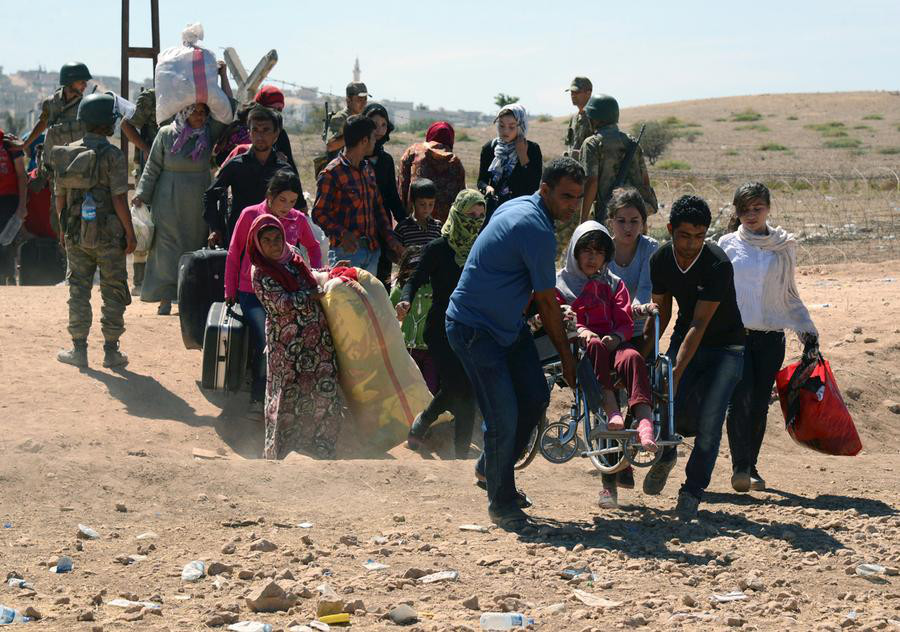 Suriye'deki savaştan kaçarak Türkiye'ye gelen Suriyeli göçmenler